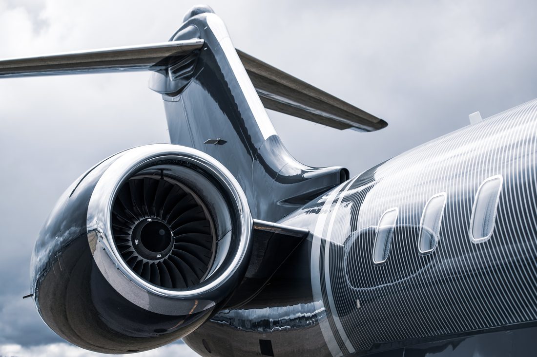 Close-up of a private jet tail and engine